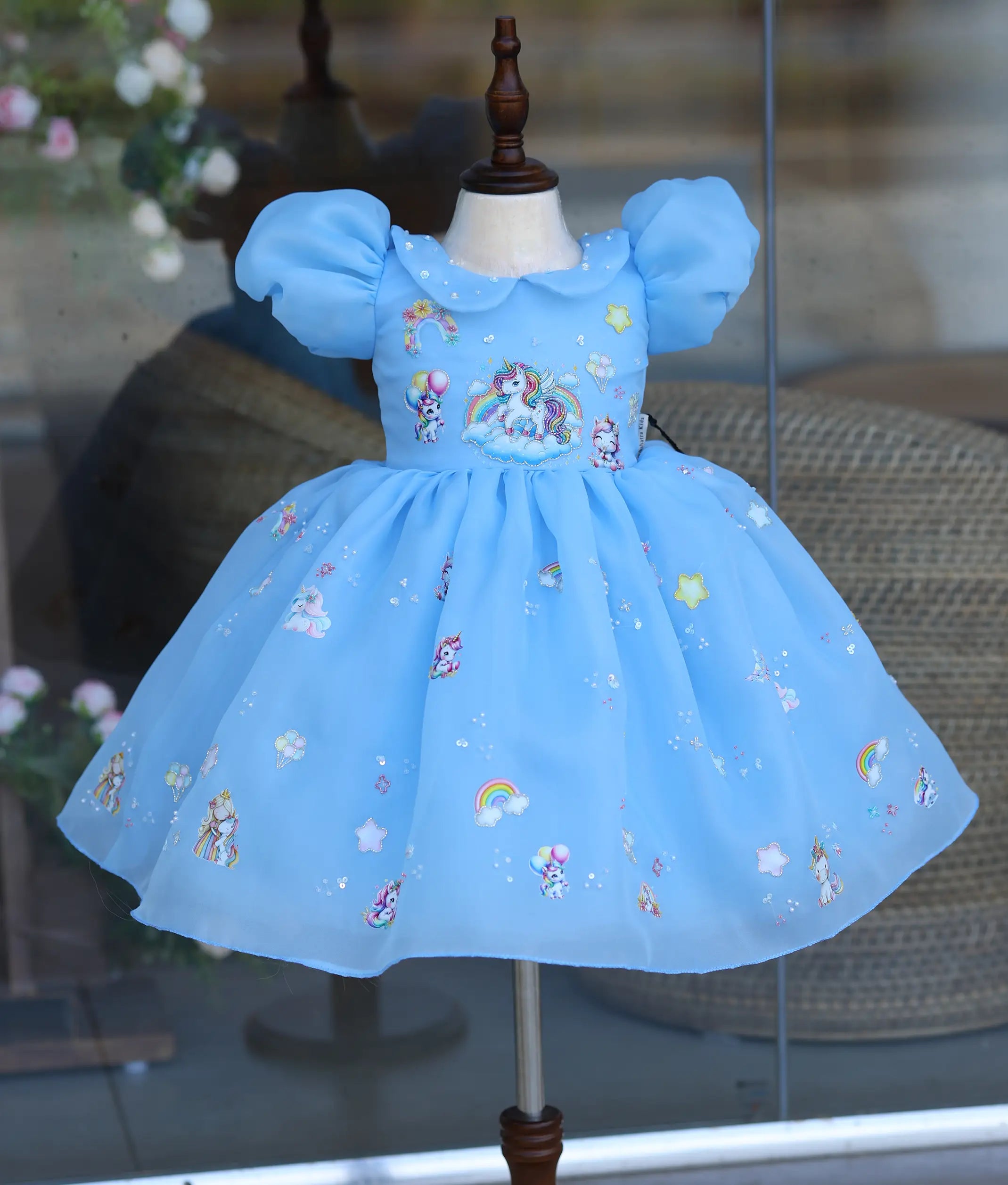 Sky blue handworked unicorn frock for baby girl with puff sleeves, perfect for birthday wear
