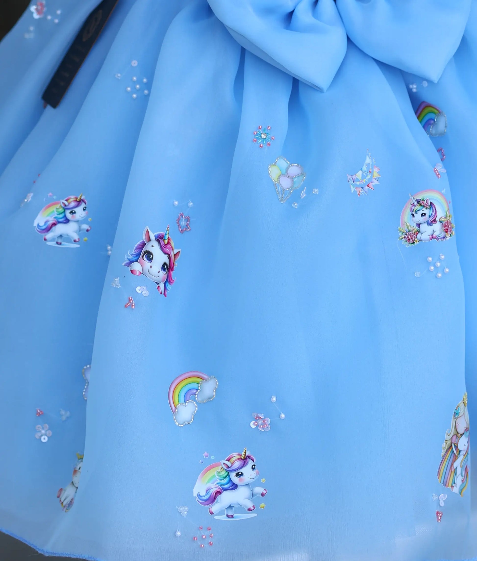 Sky blue unicorn theme frock for baby girl with handworked rainbow and sequin detailing