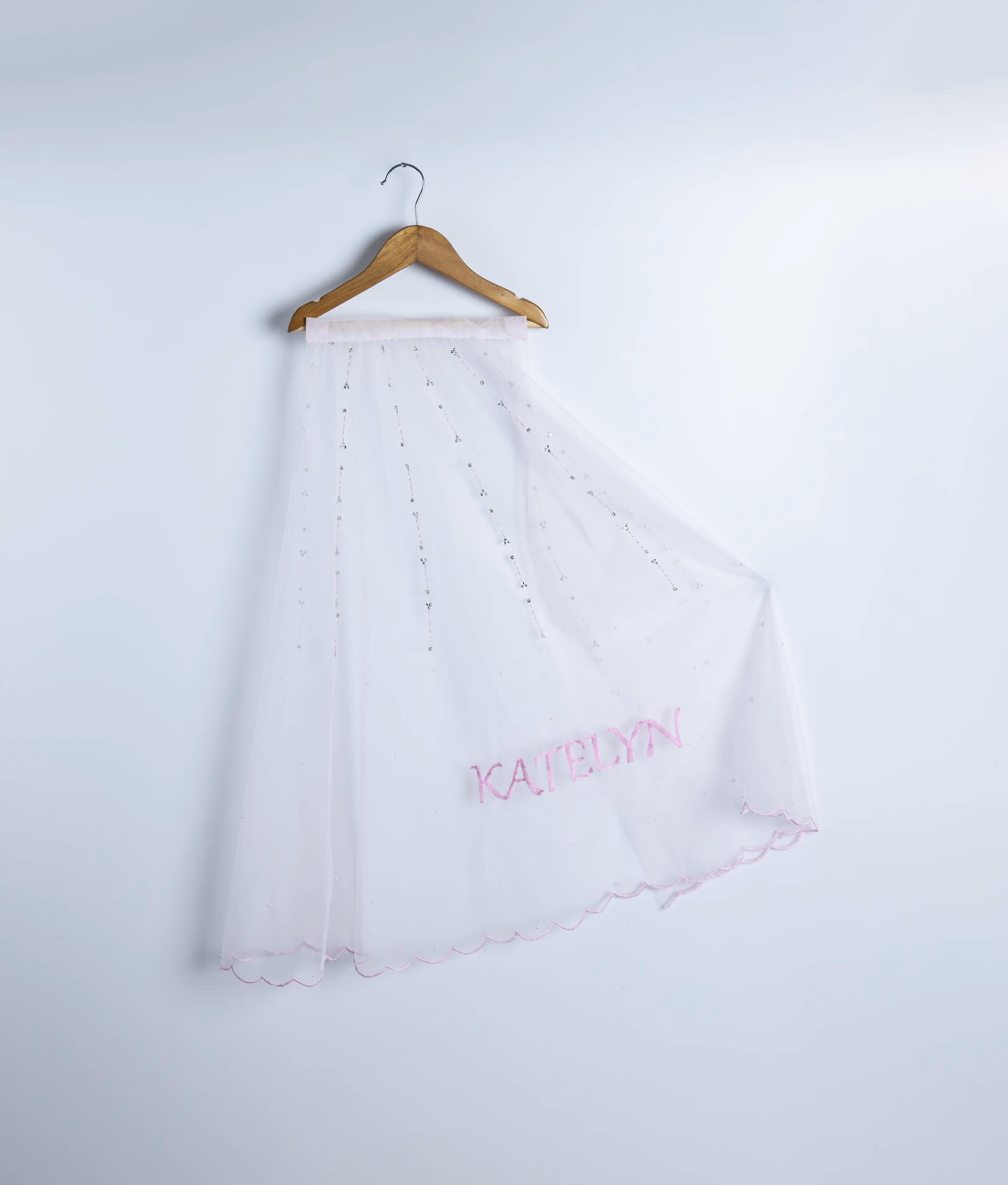 Front view of a stylish handworked tulle net tail for girls' party wear 