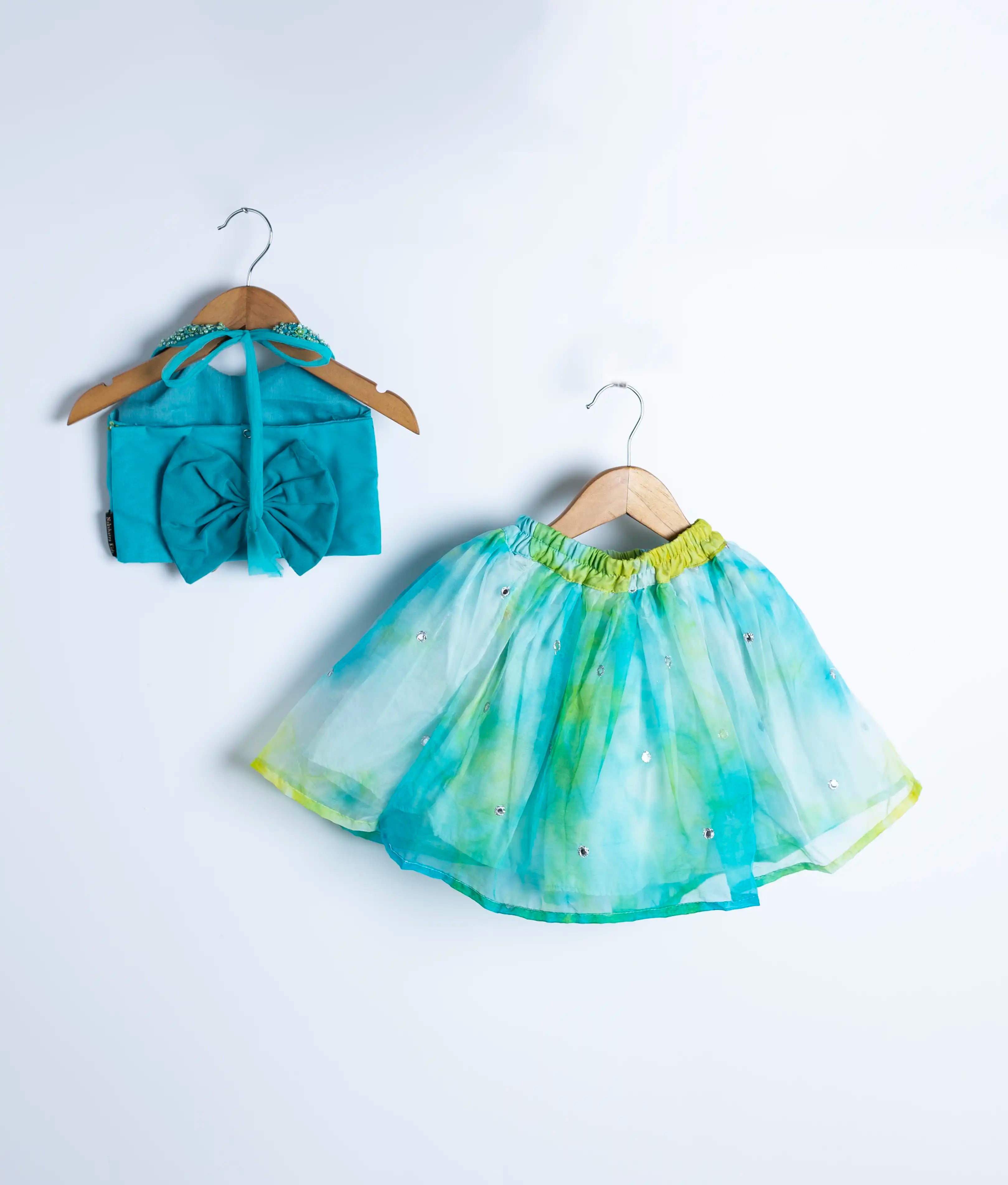 Full view of turquoise swan theme party dress with flowing tulle net skirt for baby and toddler girls