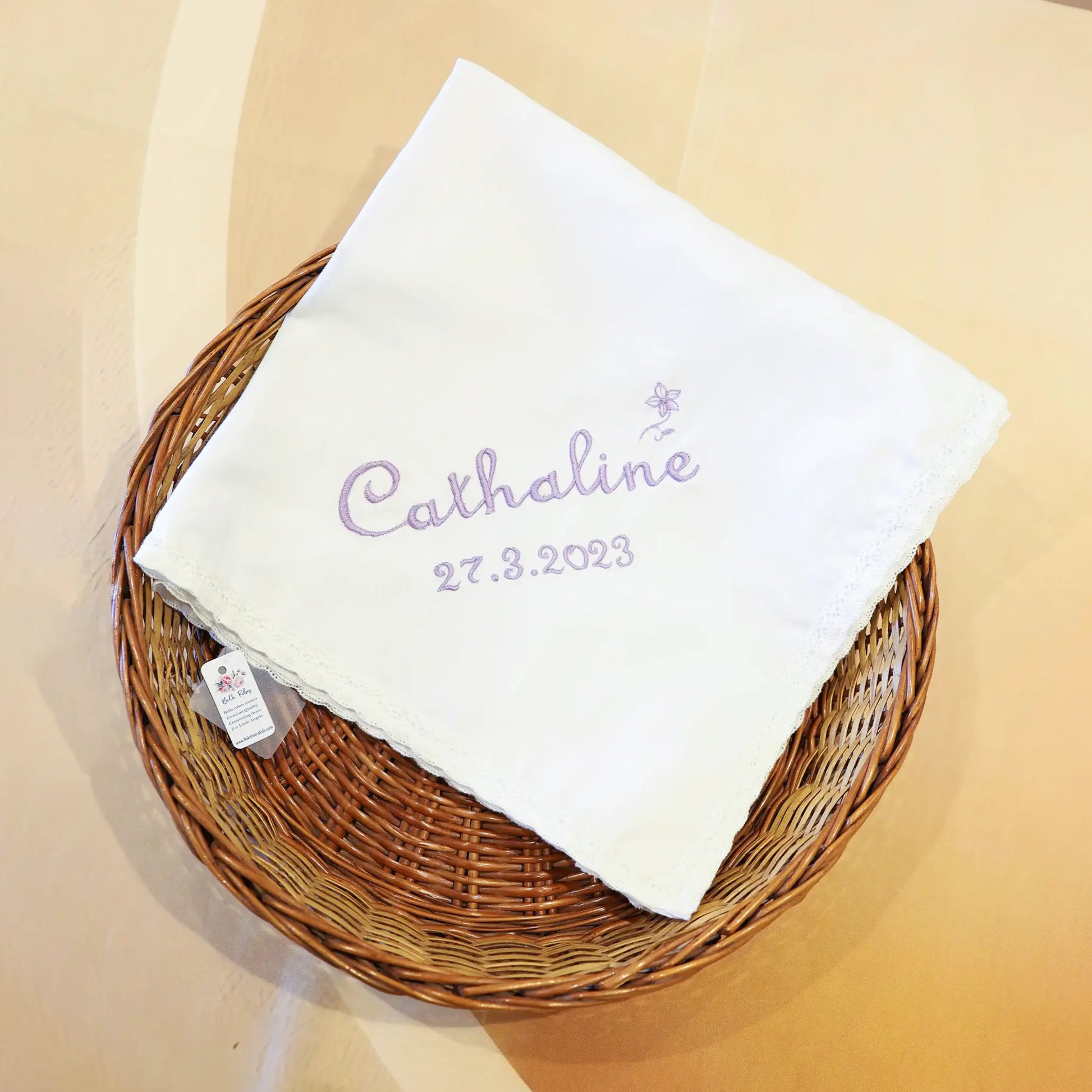 Soft white cotton baptism towel for babies with delicate floral embroidery and scalp borders