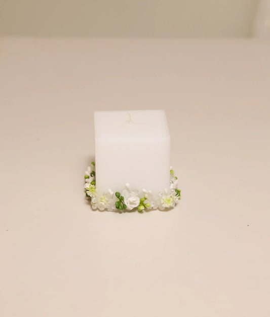 Elegant white floral decorative baptism candle featuring handcrafted silk flowers and delicate lace ruffles