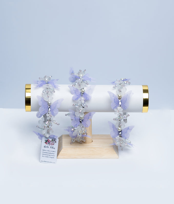 Close-up of the white lace hairband showing the detailed scalloped edges and tiny hand-stitched floral embroidery