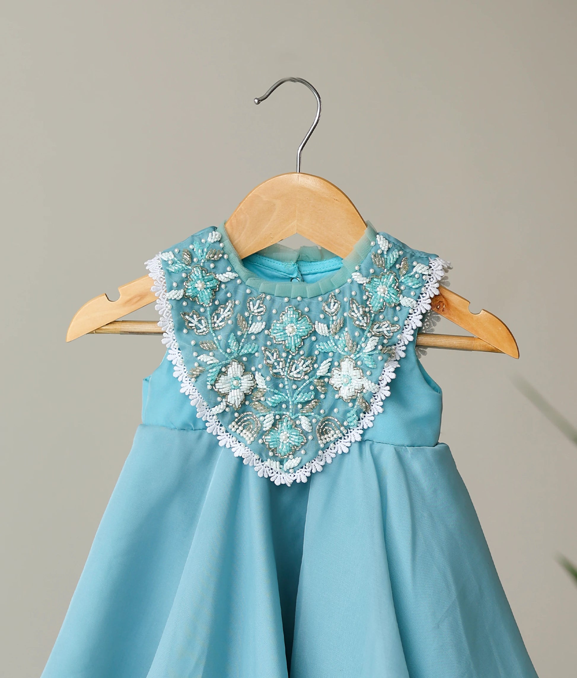 Close view of butter organza handworked birthday gown for baby girl 