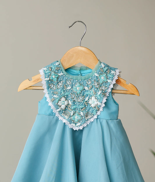 Close view of butter organza handworked birthday gown for baby girl 