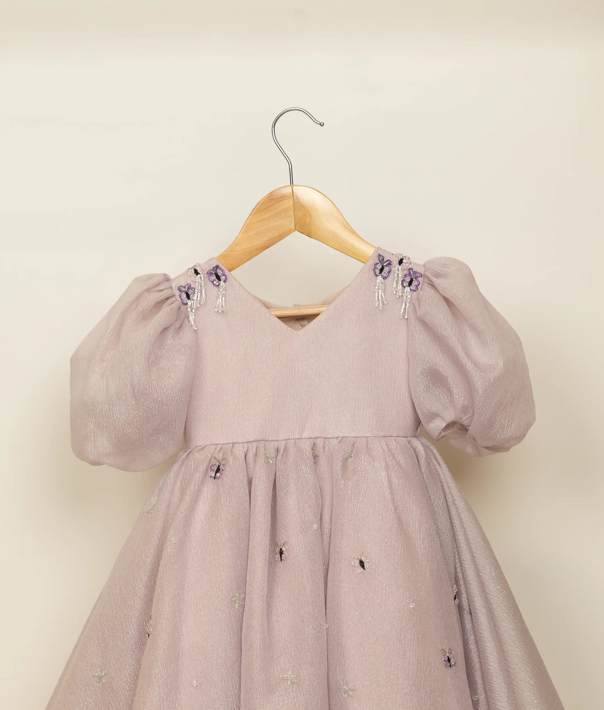 Close view of pastel lavender crush organza butterfly handworked birthday gown 