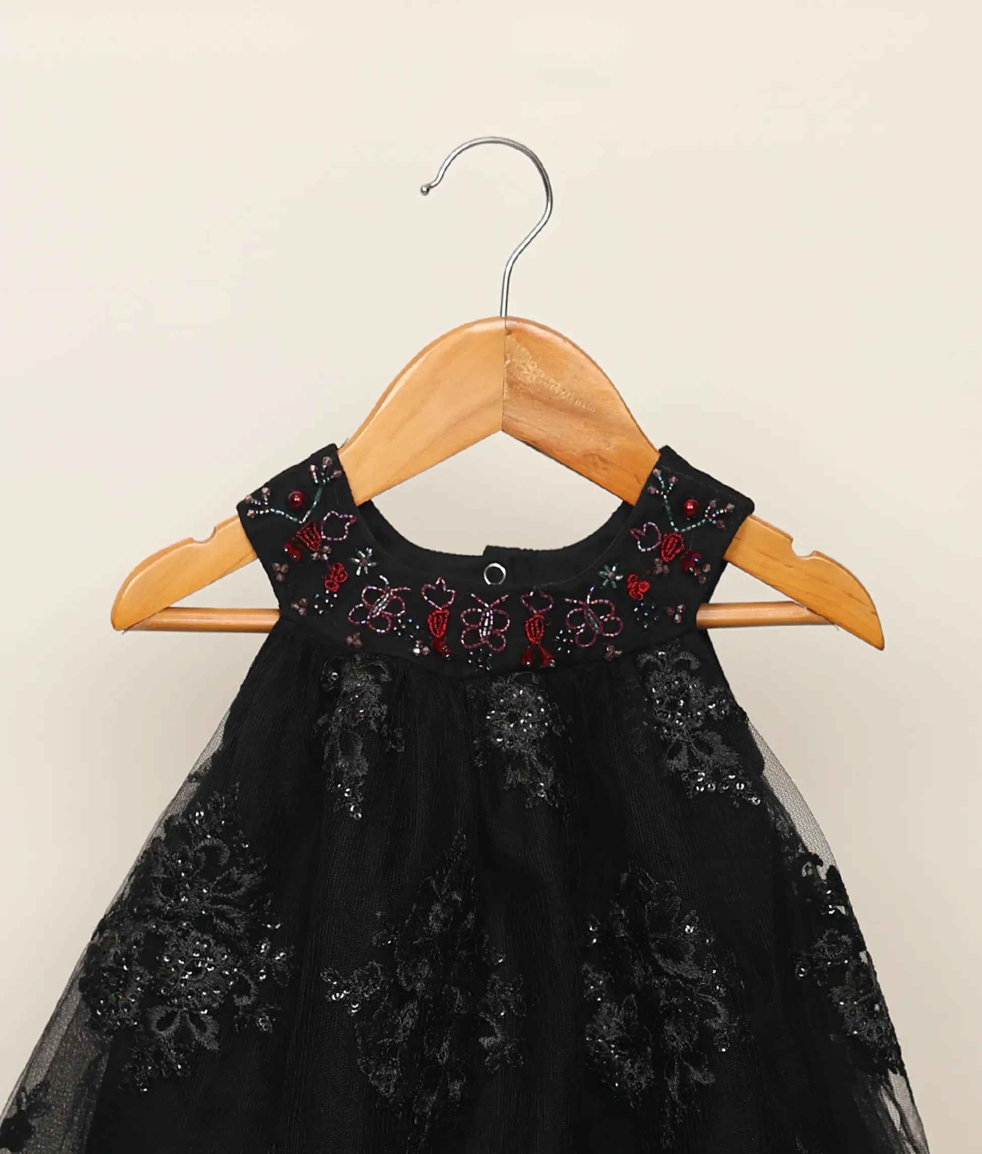 Close view of work material a-line handworked frock against plain background