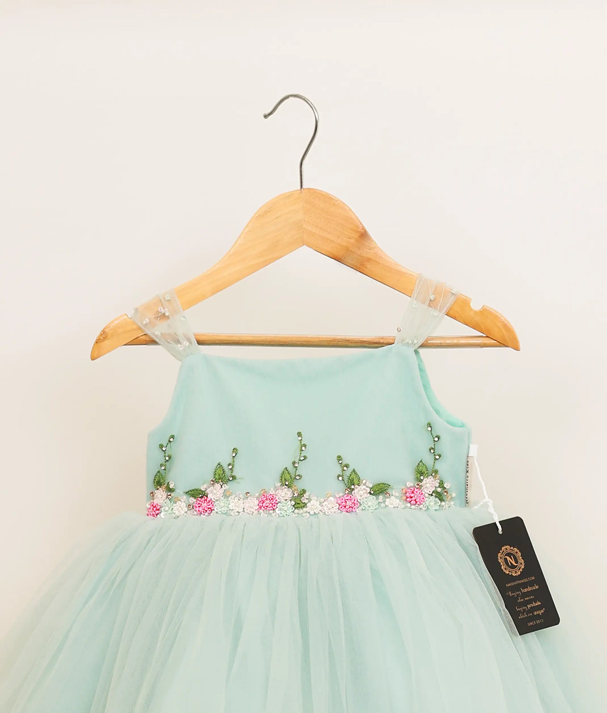 Close view of powder blue tulle net handworked birthday frock