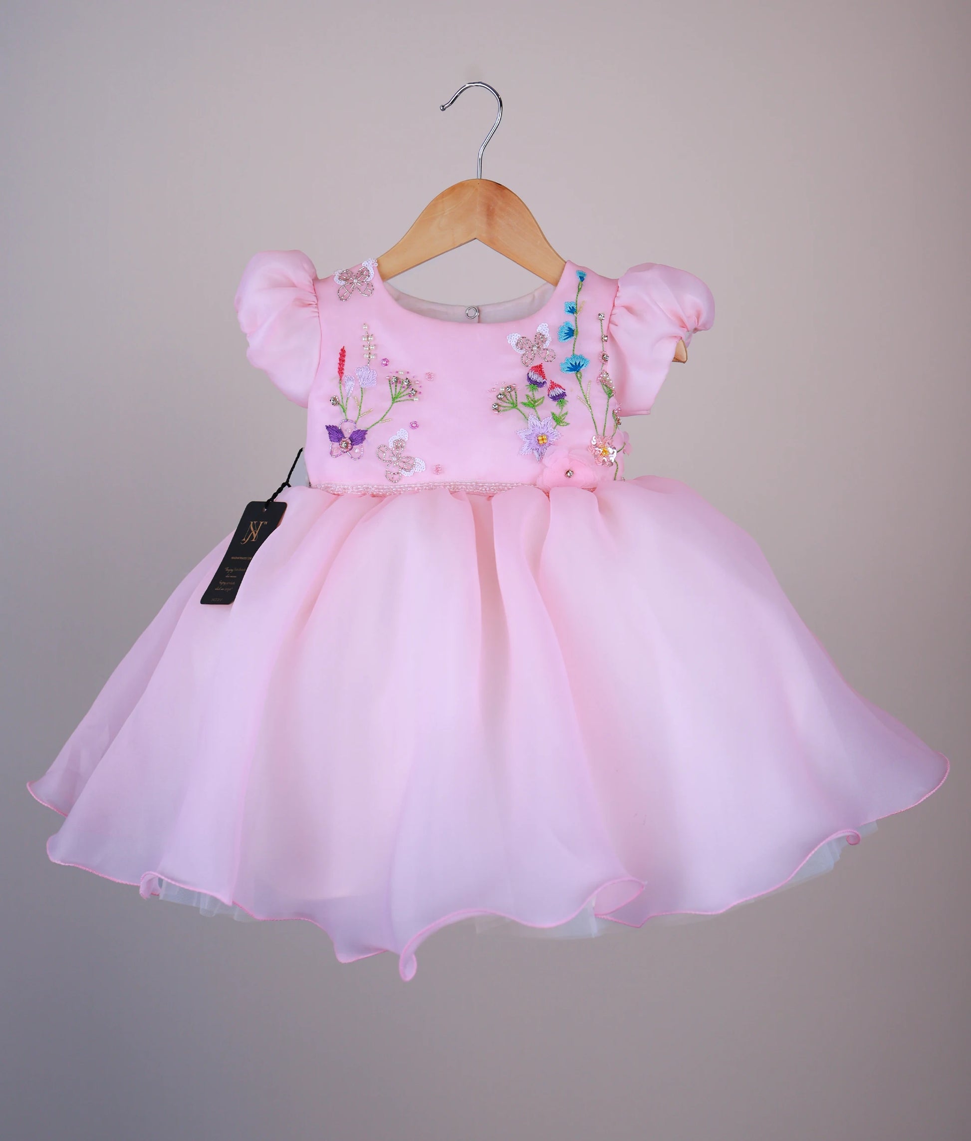 Pink plain organza baby girl frock with embroidered butterfly and floral designs on the bodice