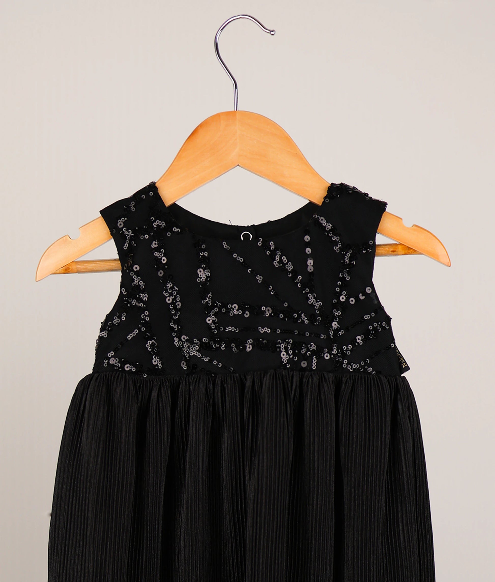 Close view of satin crush a-line frock against white background 