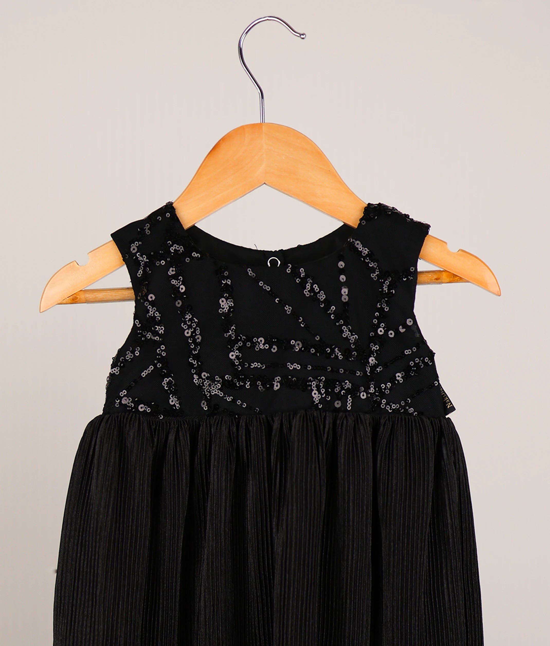 Close view of satin crush a-line frock against white background 