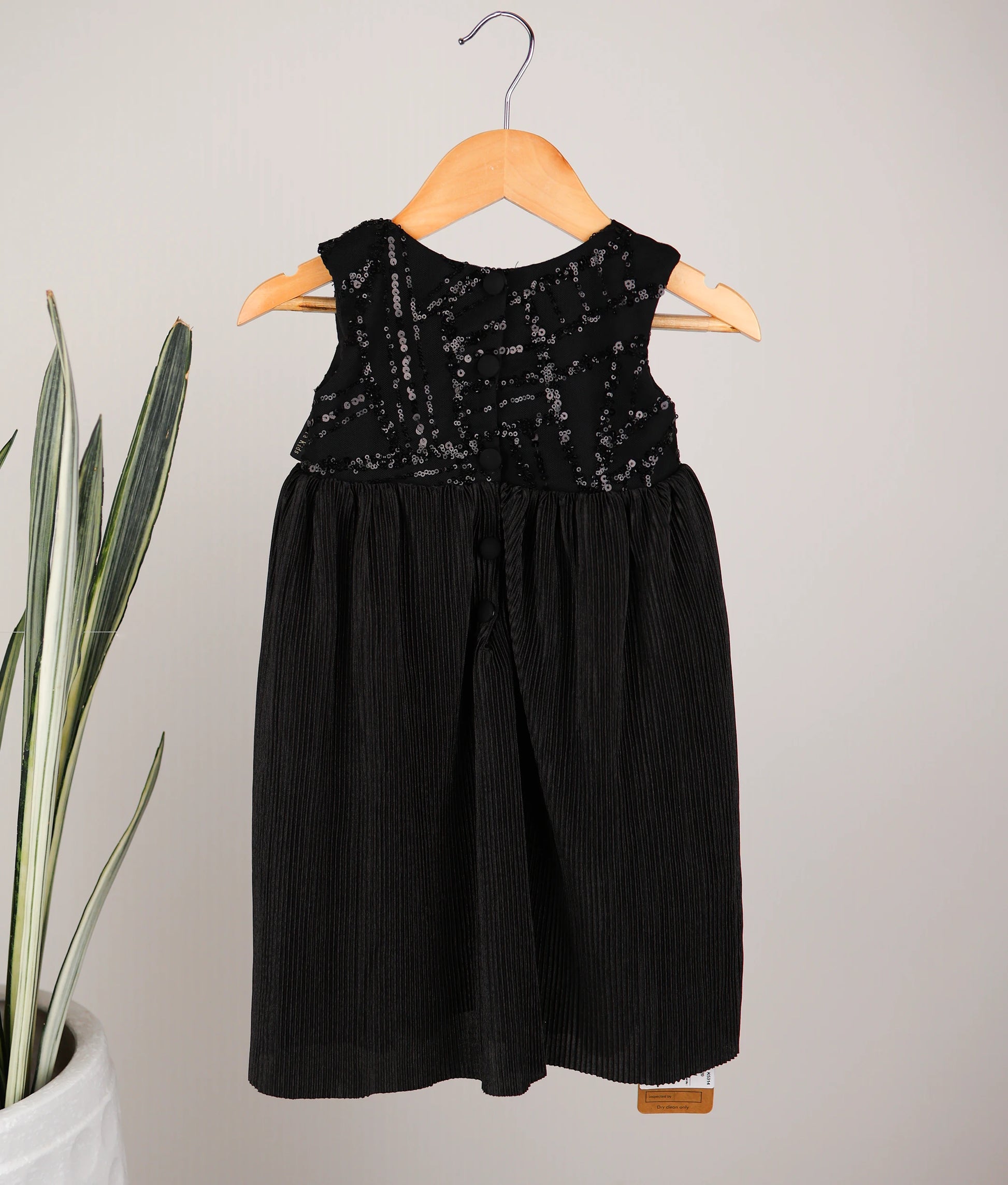 Back view of satin crush a-line frock against white background 