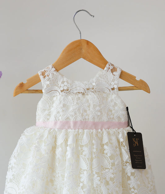 Close view of off-white crochet baptism frock for baby girl