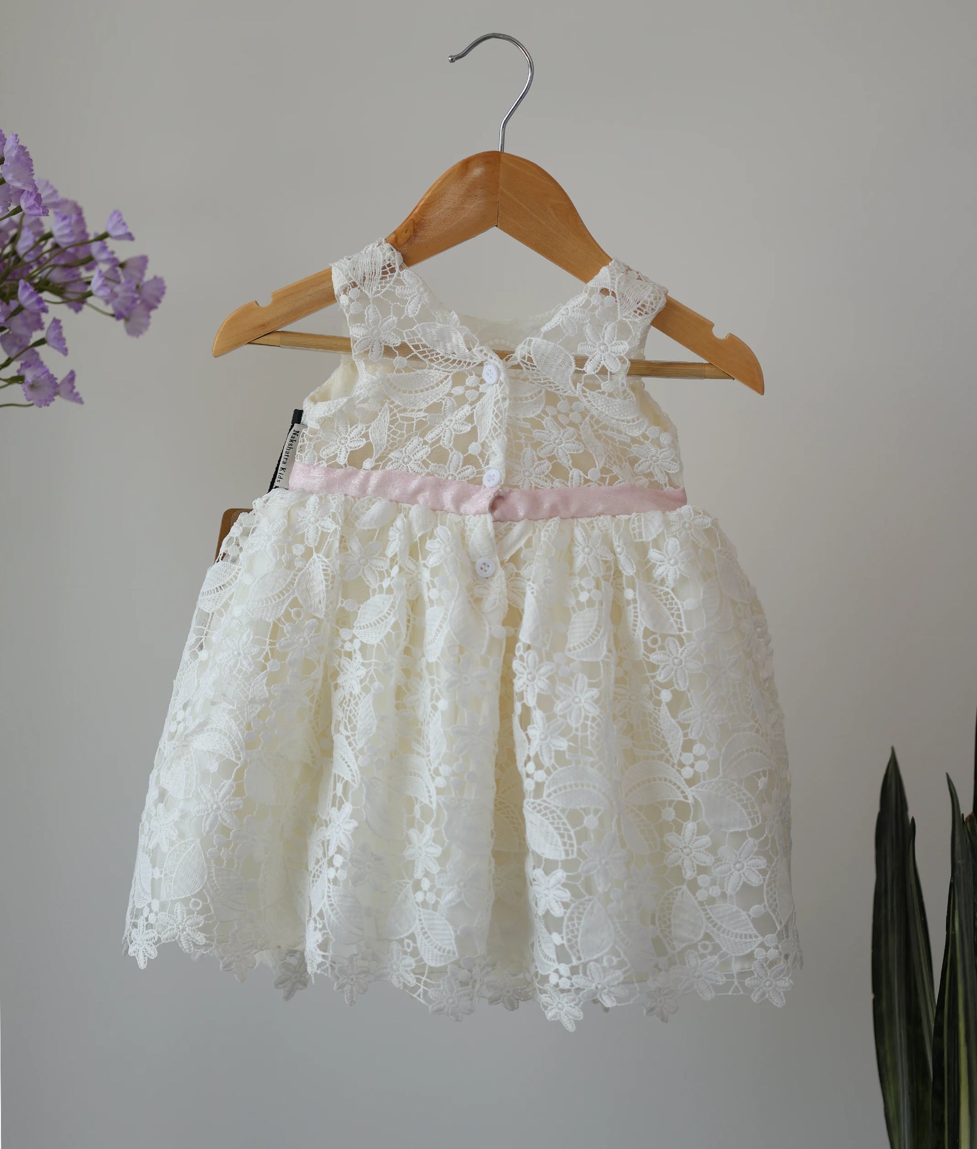 Back view of off-white crochet baptism frock for baby girl