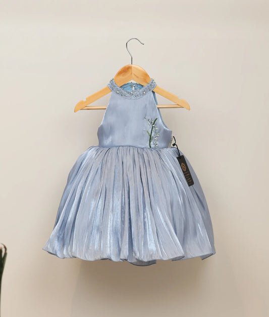 Ash blue laser organza floral handworked birthday frock against plain background