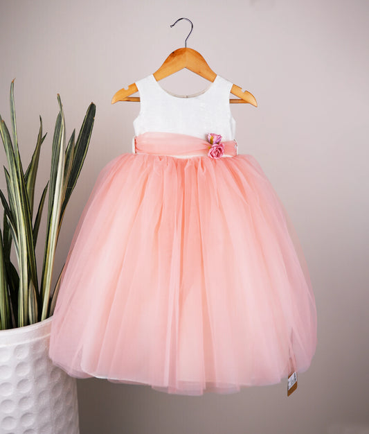 Front view of milan foil yoke with peach skirt birthday frock with white background 
