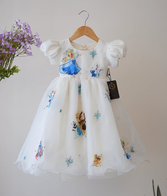 Front view of an off-white, plain organza disney princess themed birthday gown. 