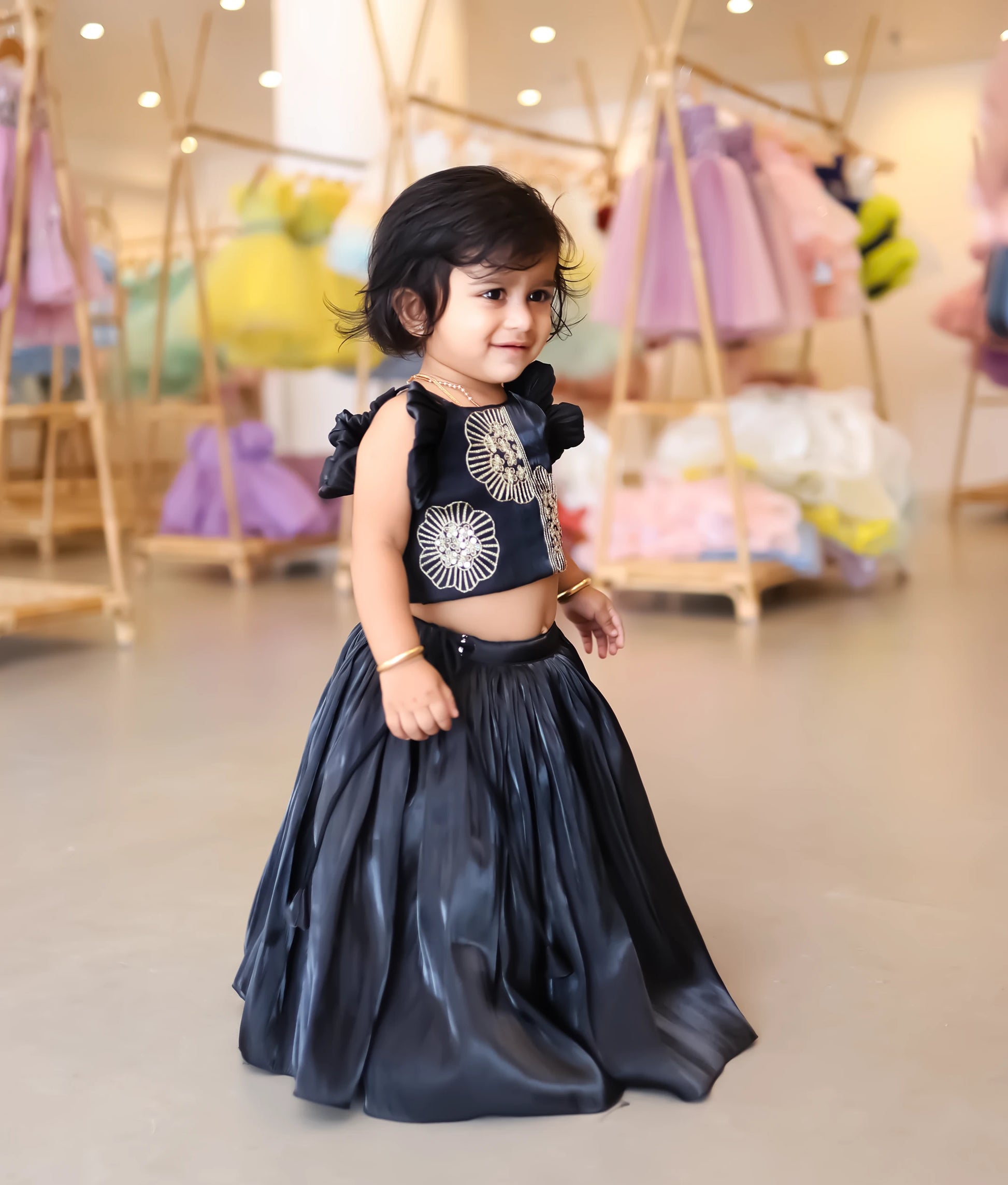 Stylish black lehenga choli with embroidered top—perfect ethnic wear for weddings and festive occasions.