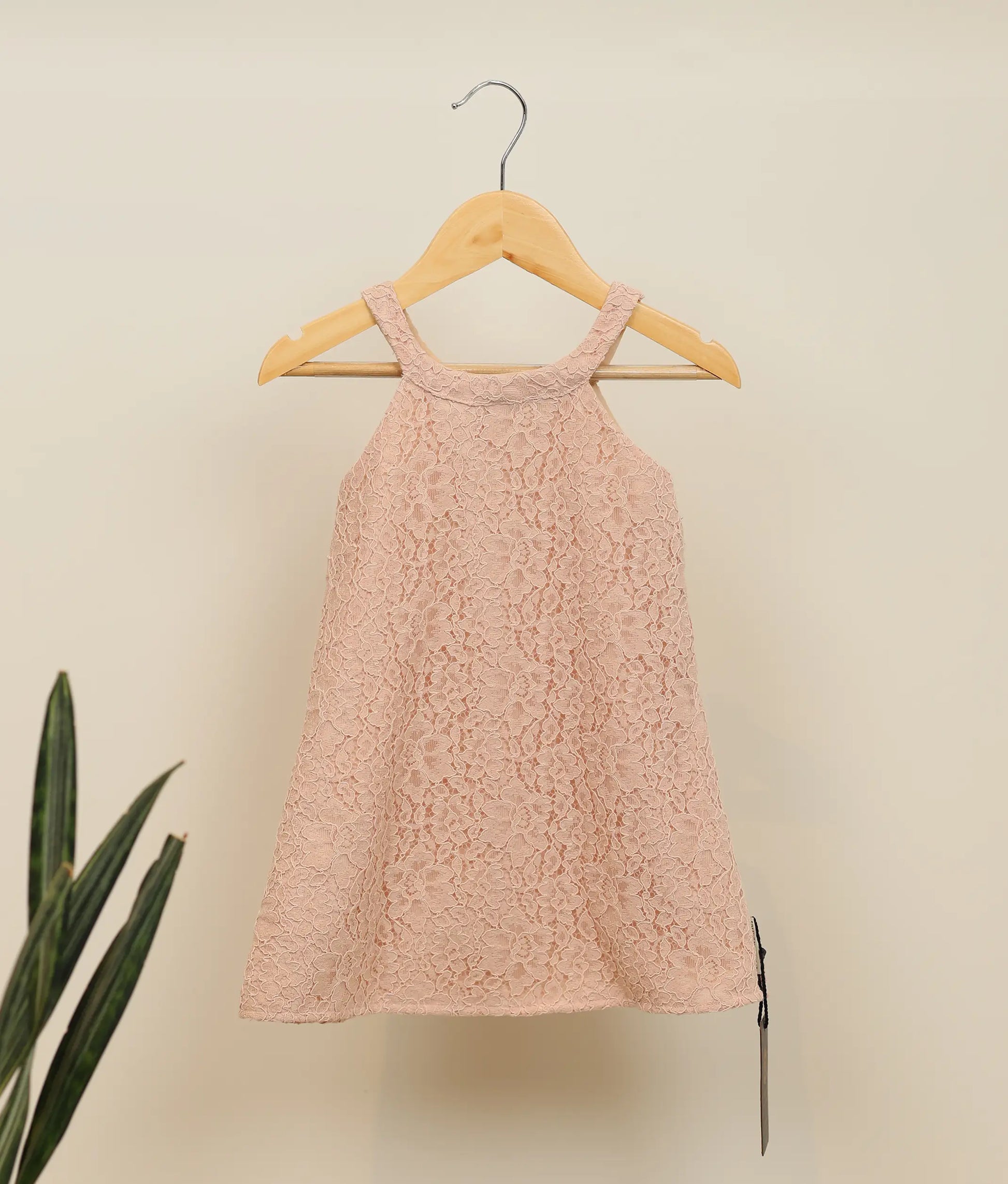 Front view of pastel peach wedding lace fabric a-line frock for baby girl 