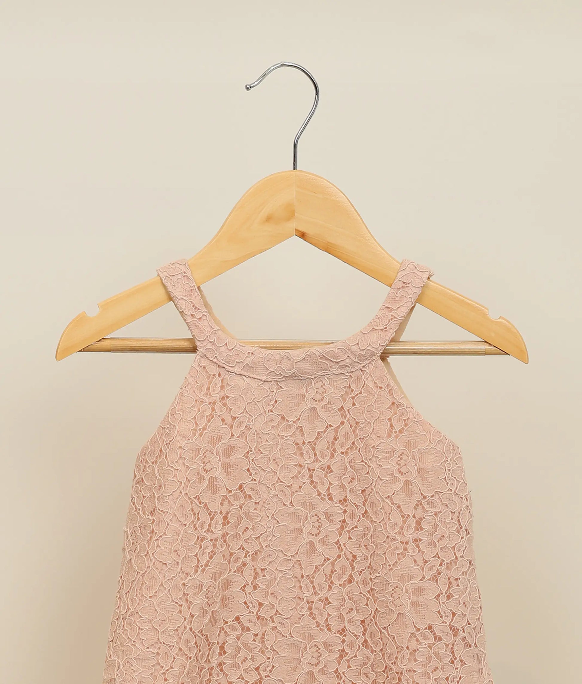 Close view of pastel peach wedding lace fabric a-line frock for baby girl 