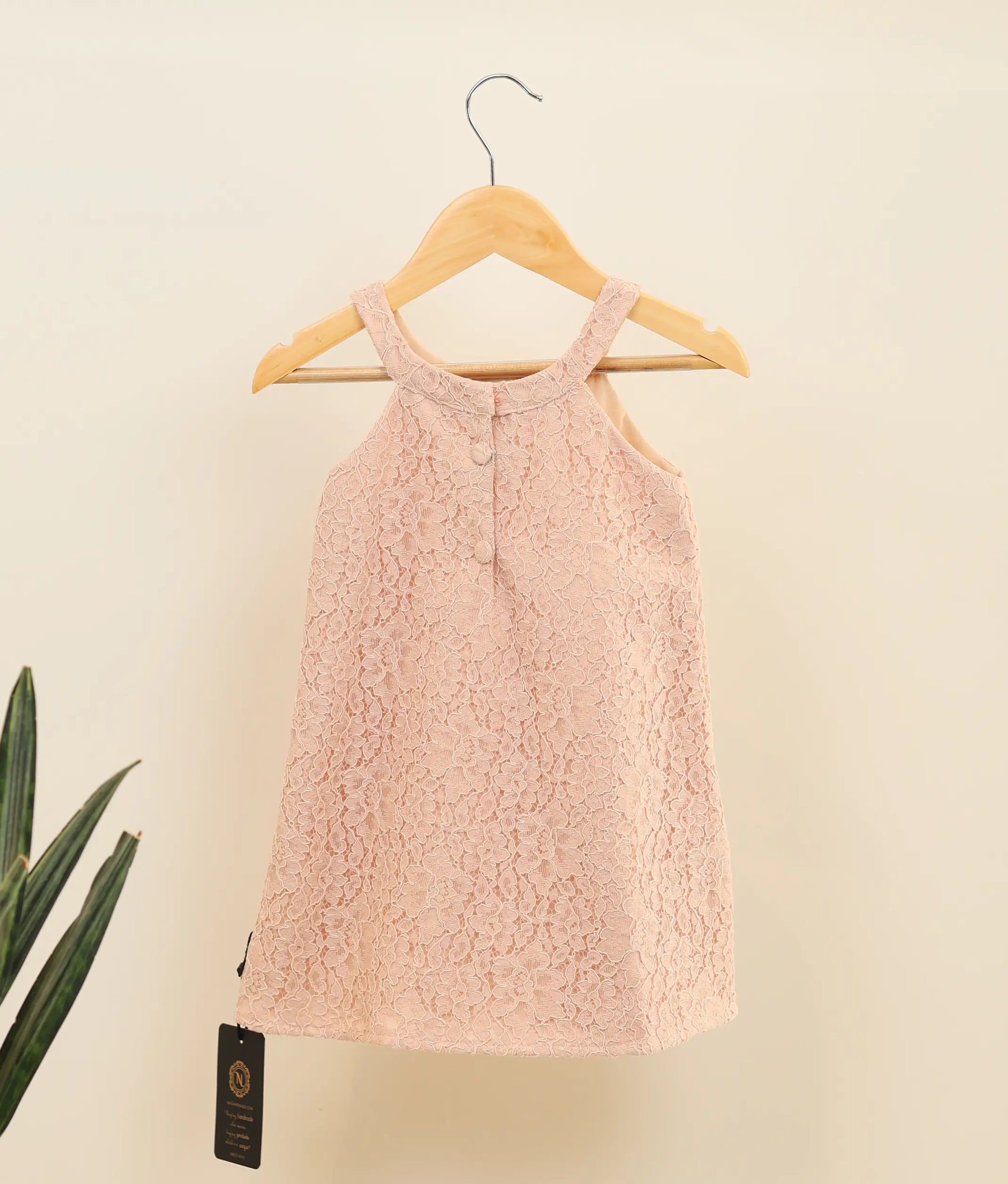 Back view of pastel peach wedding lace fabric a-line frock for baby girl 