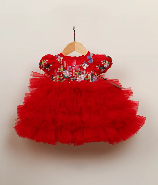 Front view of red tulle net butterfly-themed step birthday dress against plain background