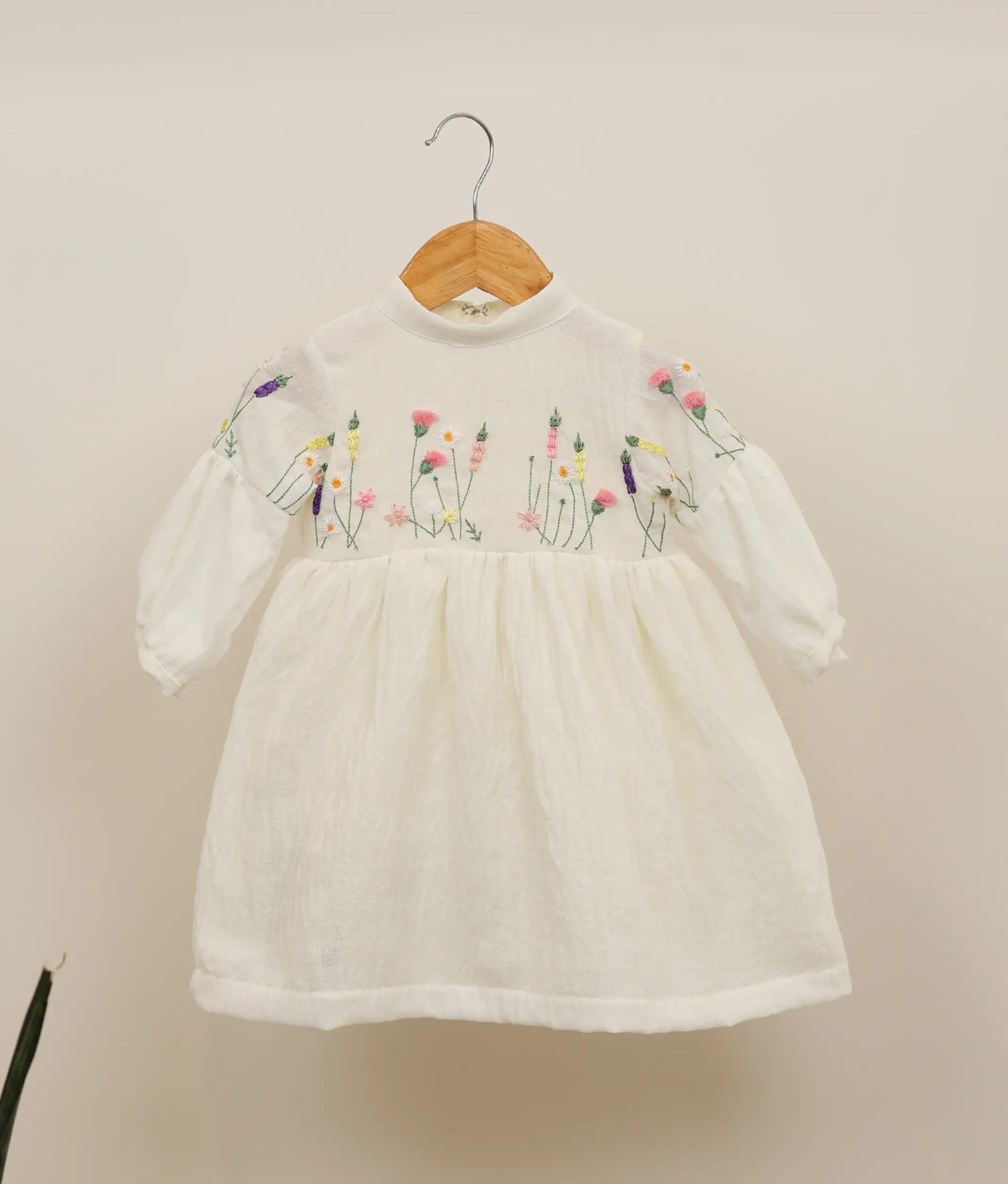 Front view of a linen cotton floral embroidery casual frock against plain background 