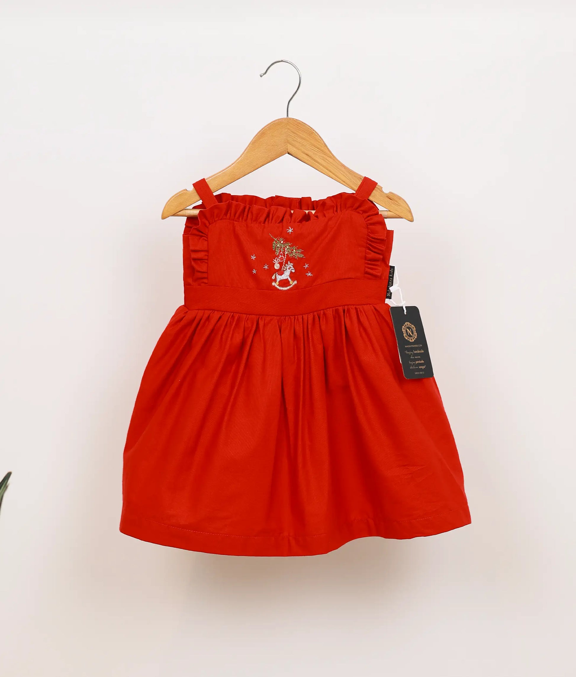 Front view of poplin embroidery Christmas frock.