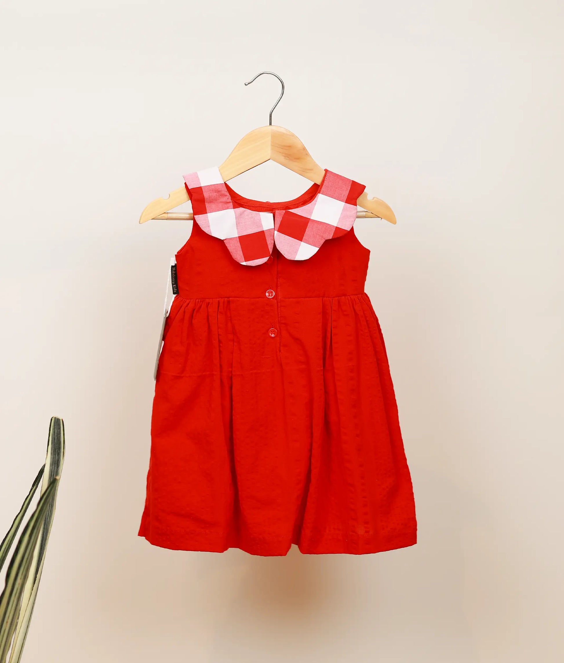 Back view of red cotton christmas frock for baby girl