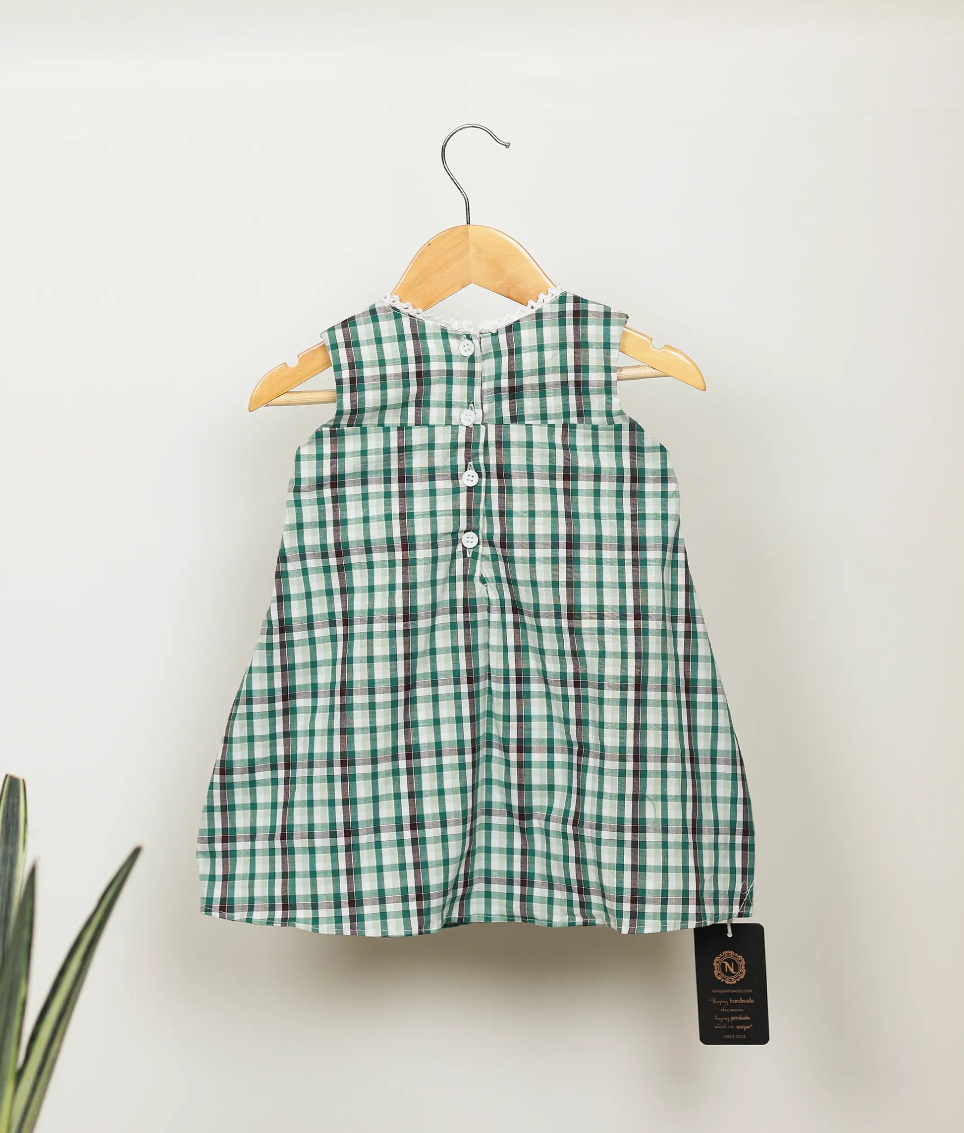 Back view of green check cotton embroidery Christmas frock  