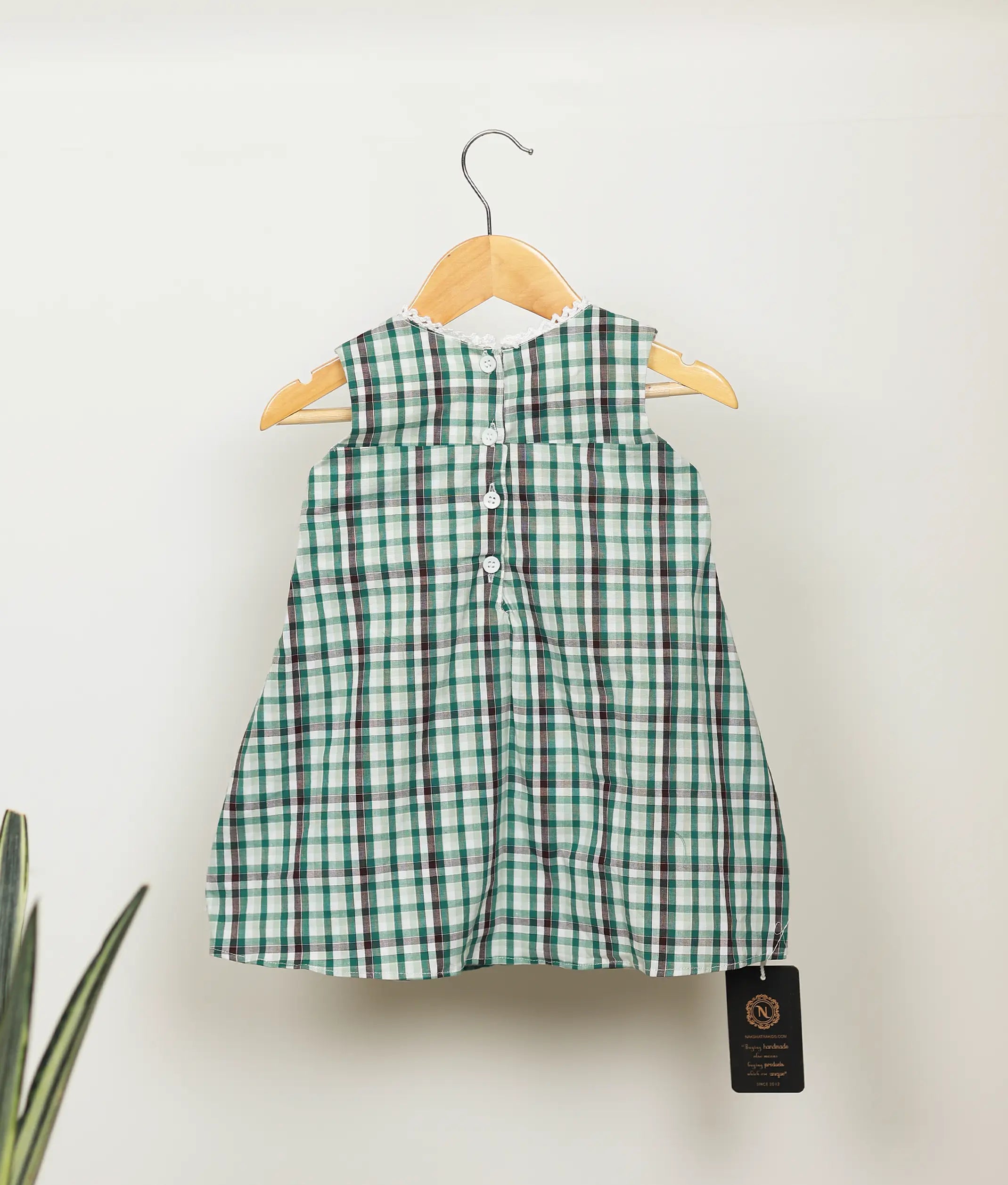 Back view of green check cotton embroidery Christmas frock  