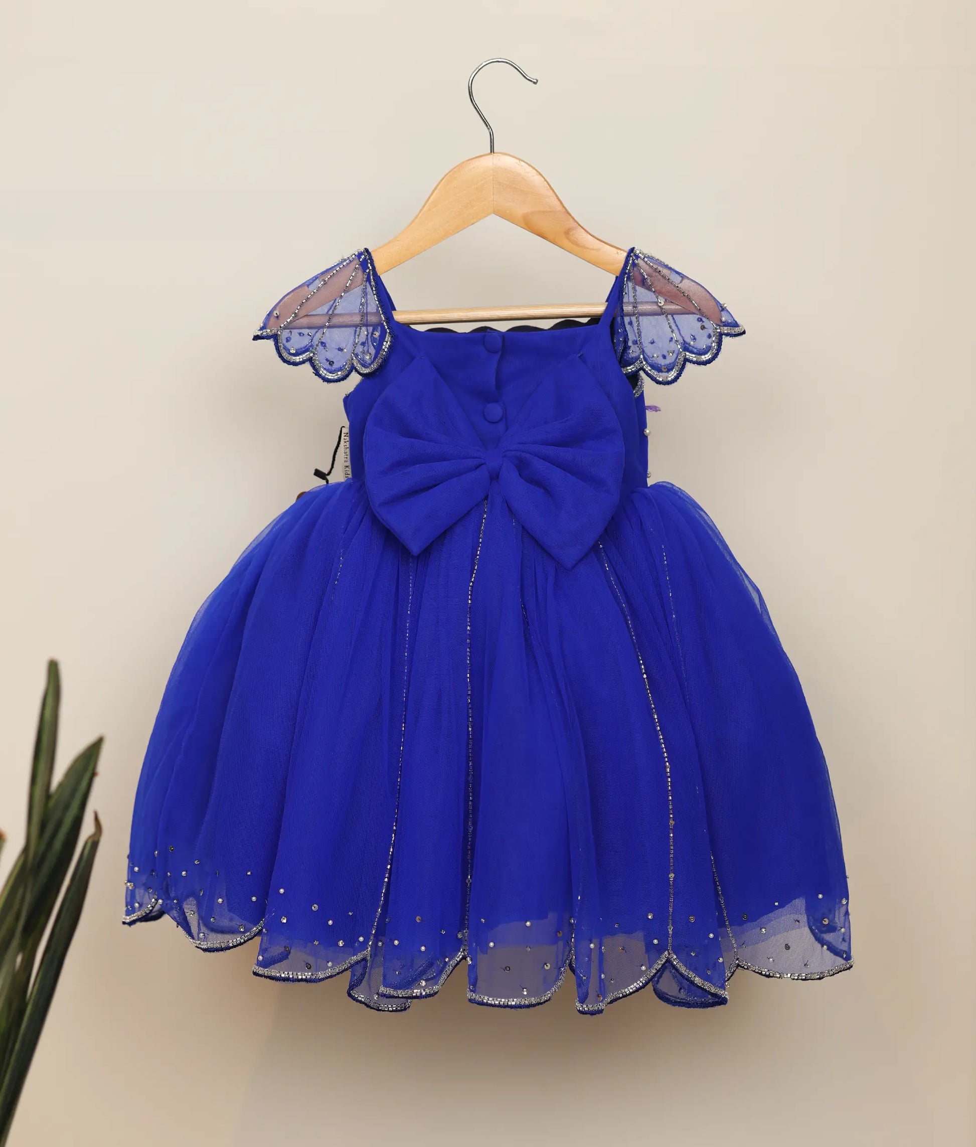Back view of royal blue tulle net handworked mermaid-themed frock for baby girl 