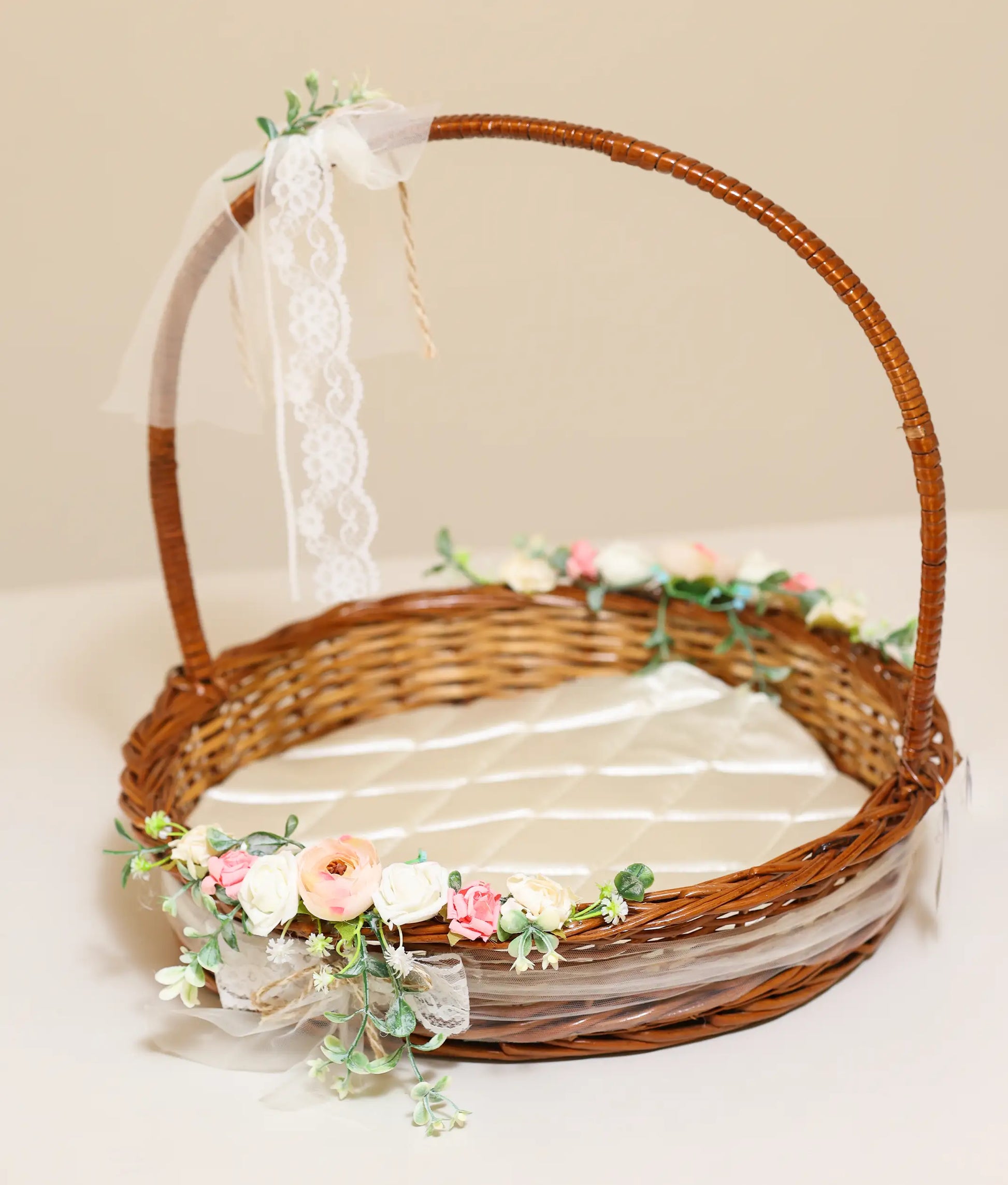Floral wicker basket for christening against plain background