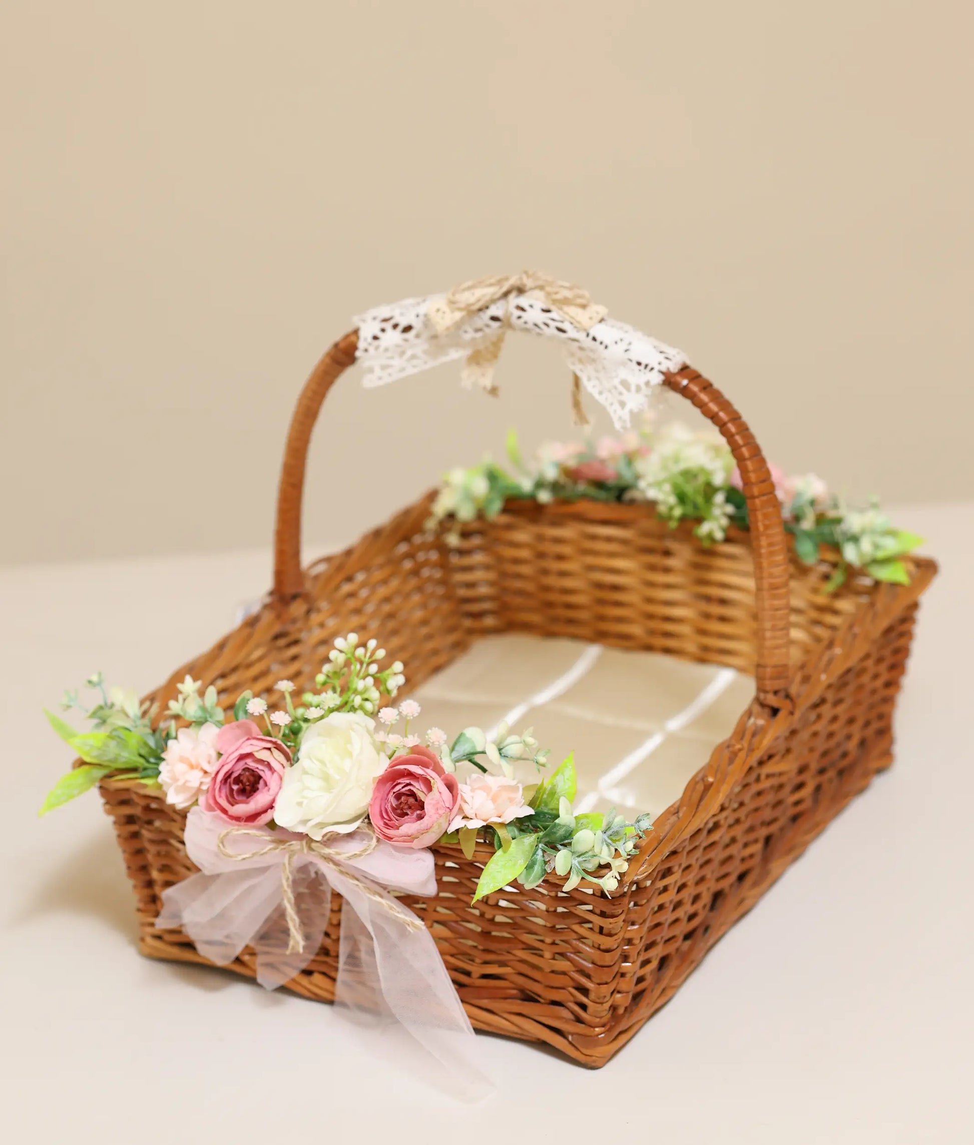 Close view of floral wicker basket for baptism against plain background