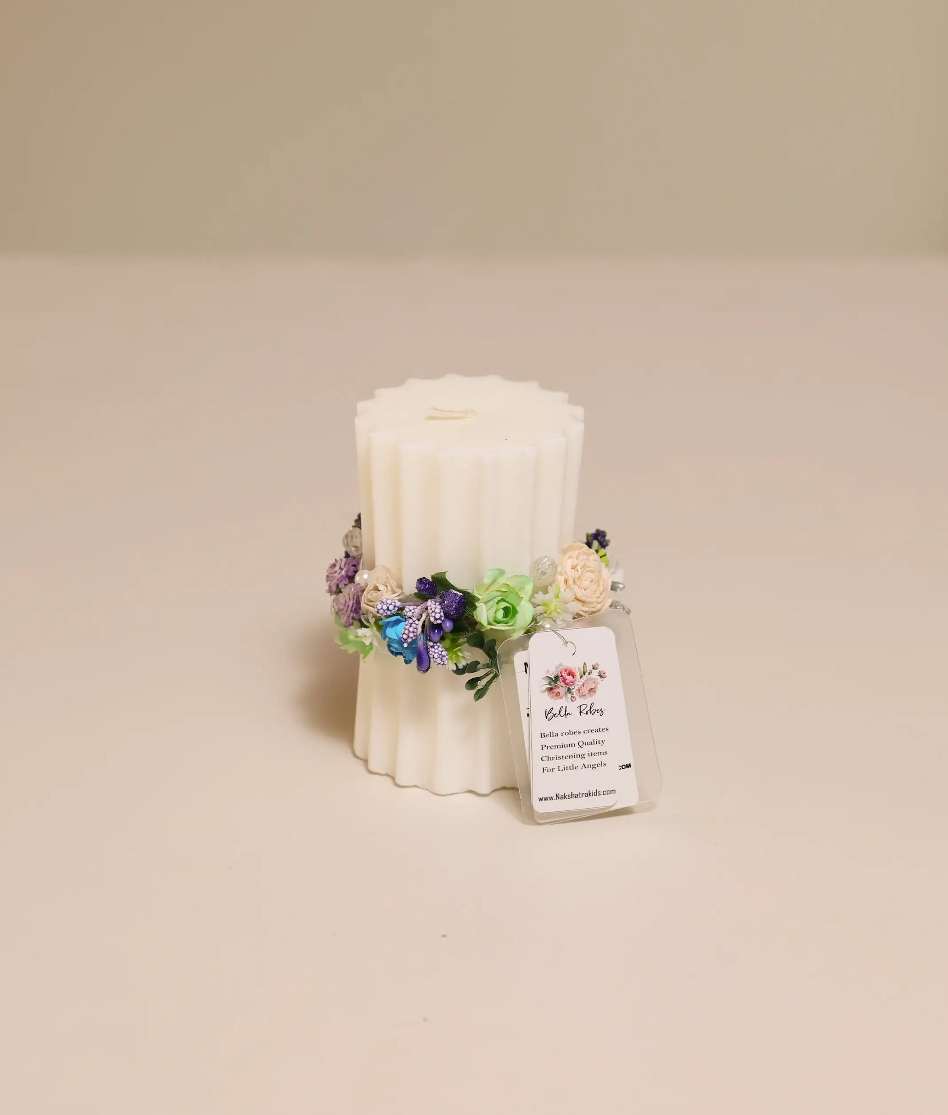 Close view of off-white  pillar floral flower candle for your baby baptism 
