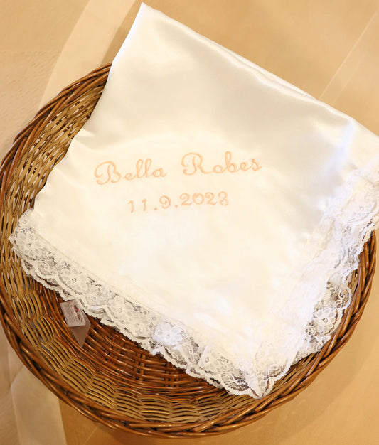 Front view of a white satin customized embroidery baptism towel.