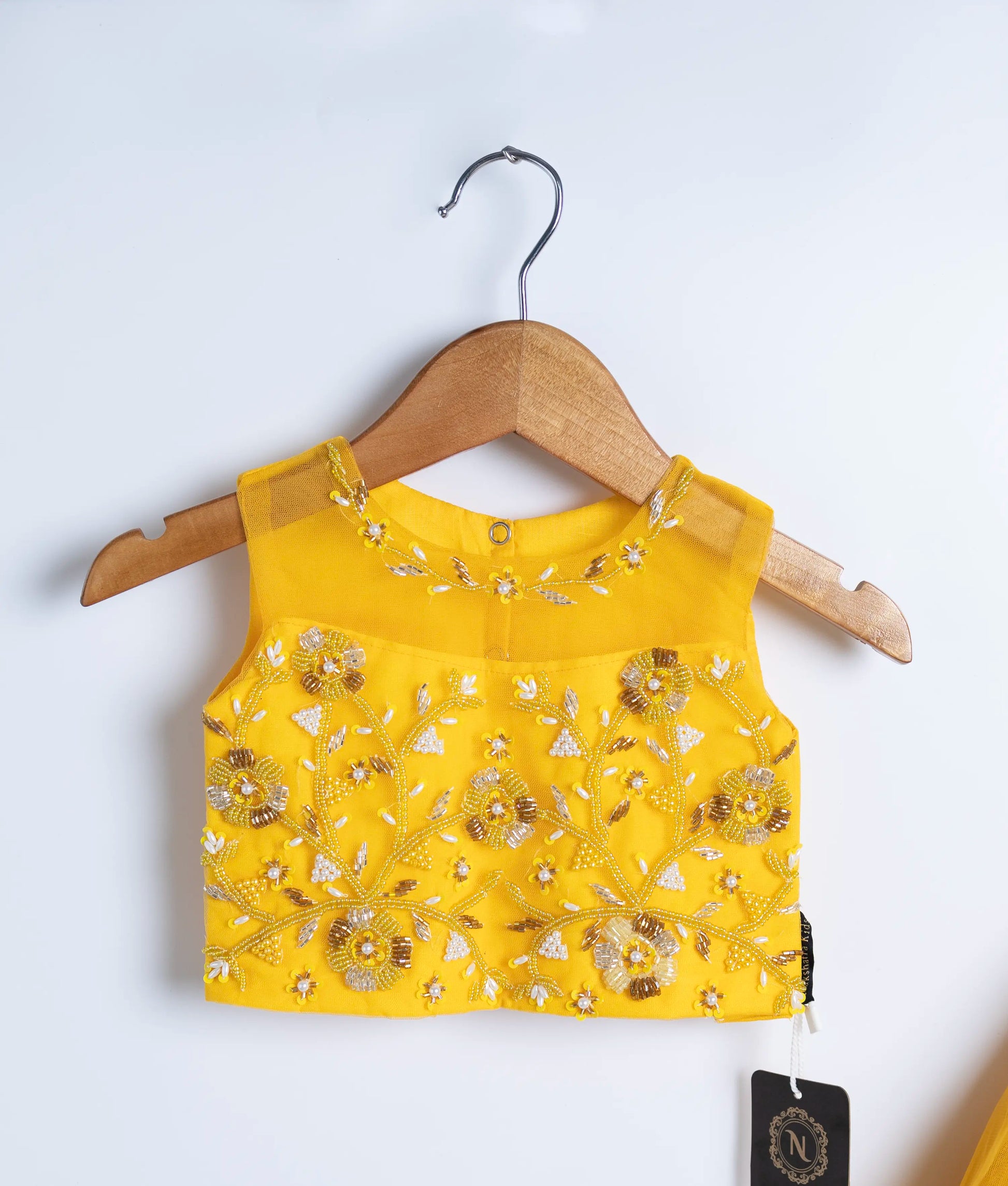 Yellow embroidered sleeveless bodice on hanger for toddler girl princess dress
